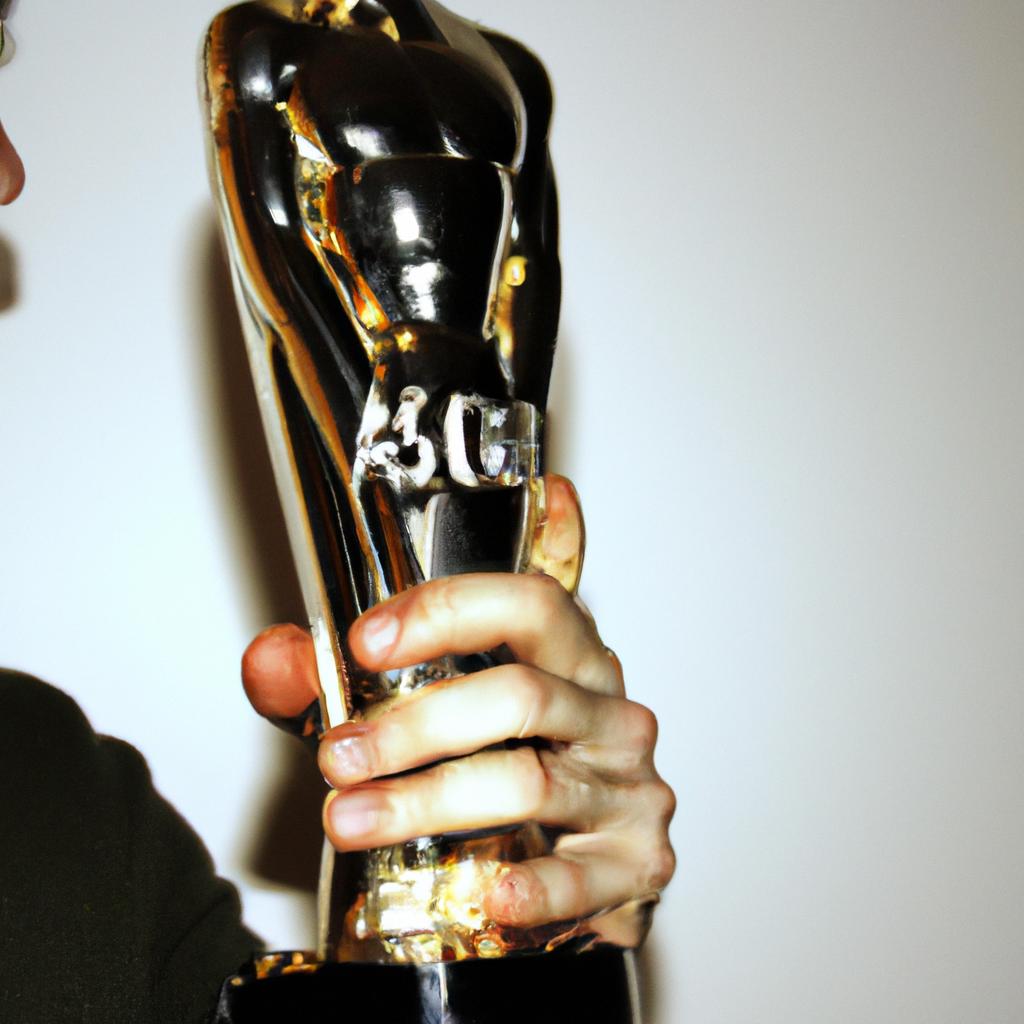Man holding an Oscar trophy