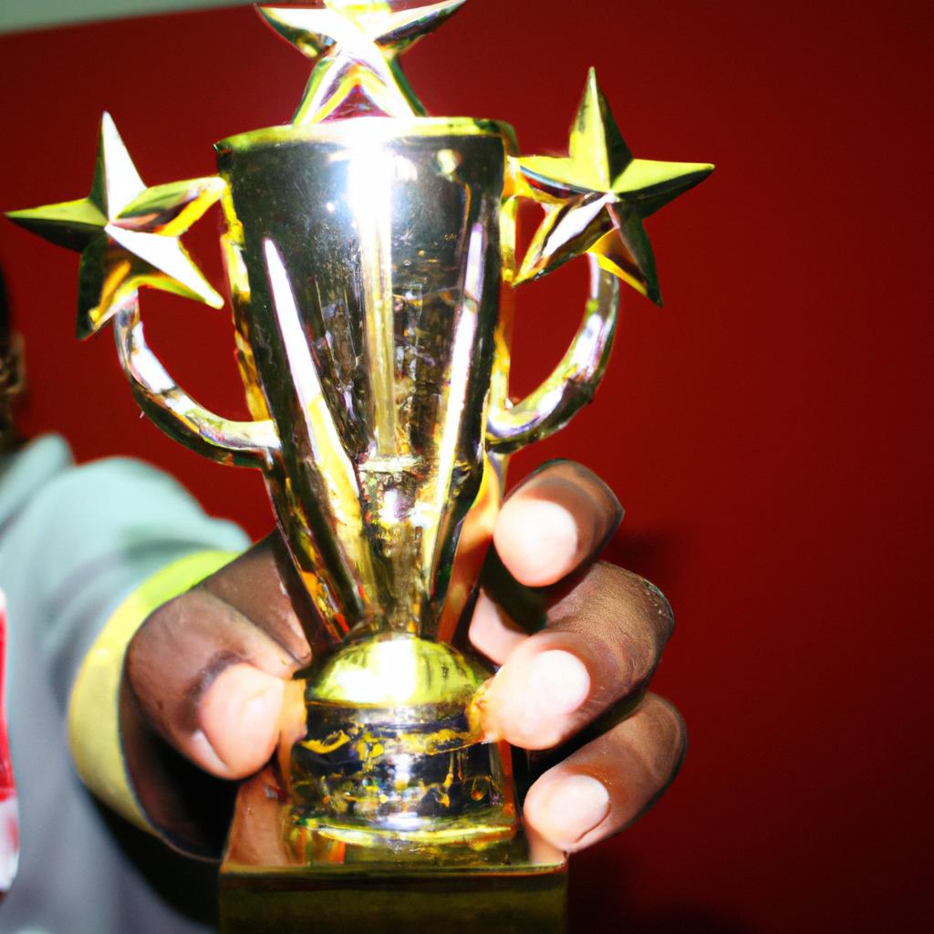 Celebrity holding a golden trophy